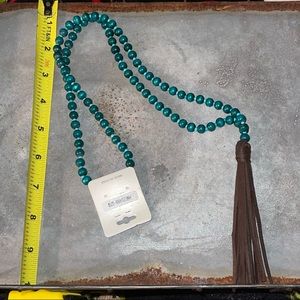 Teal beaded necklace with brown leather tassel!